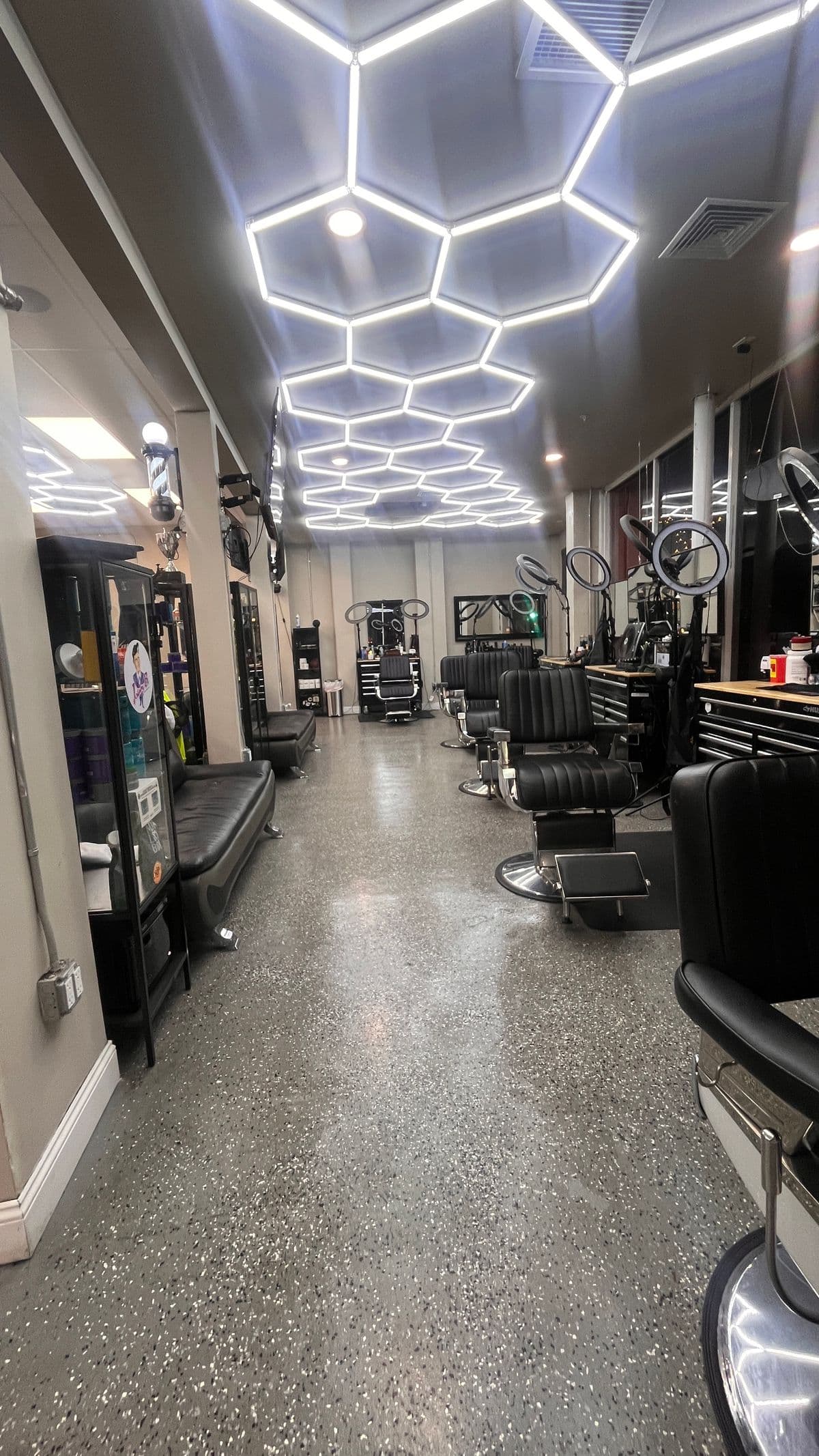 Interior view of the shop with barber chairs and waiting area